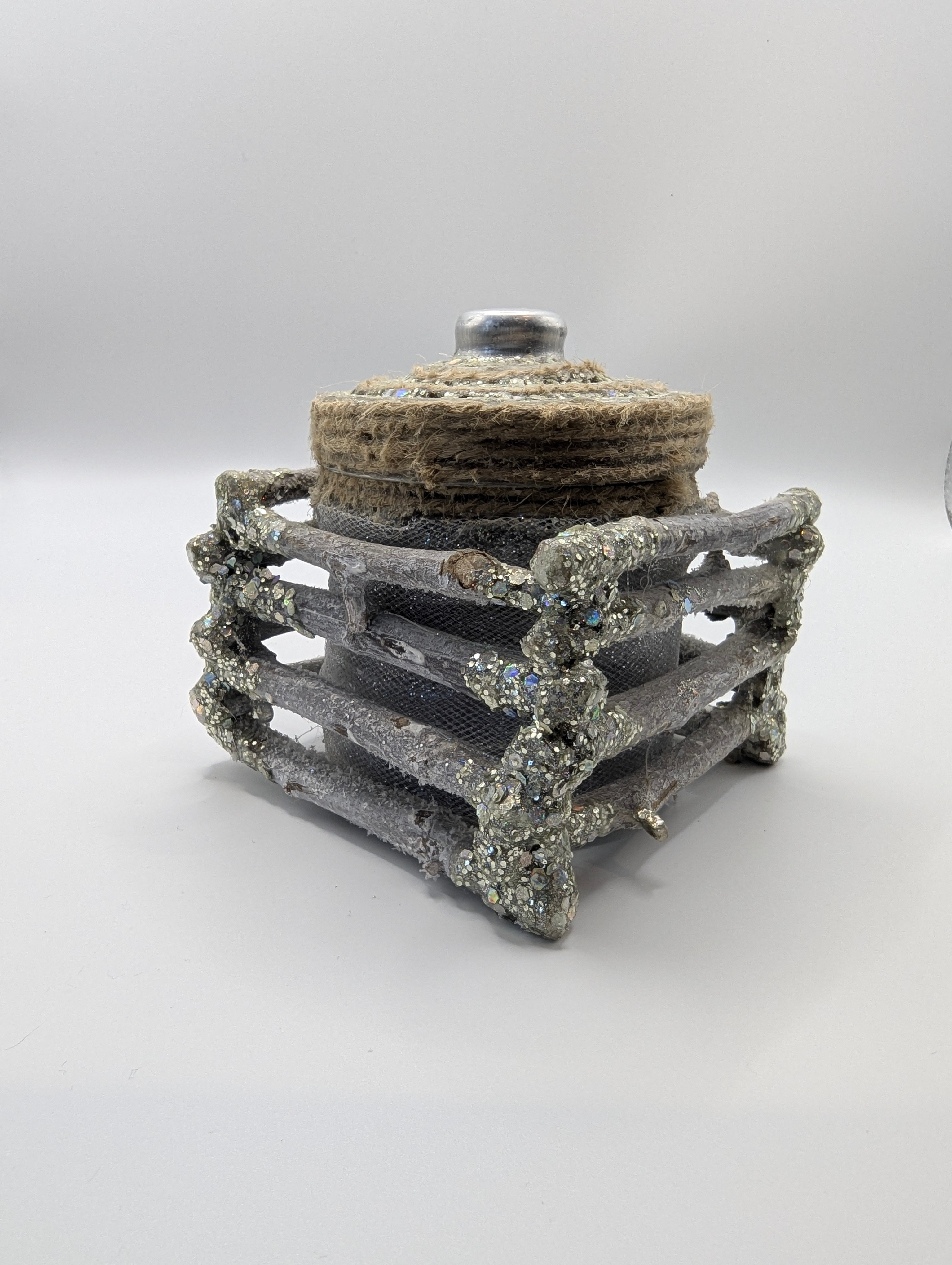 Silver and white lighted jar