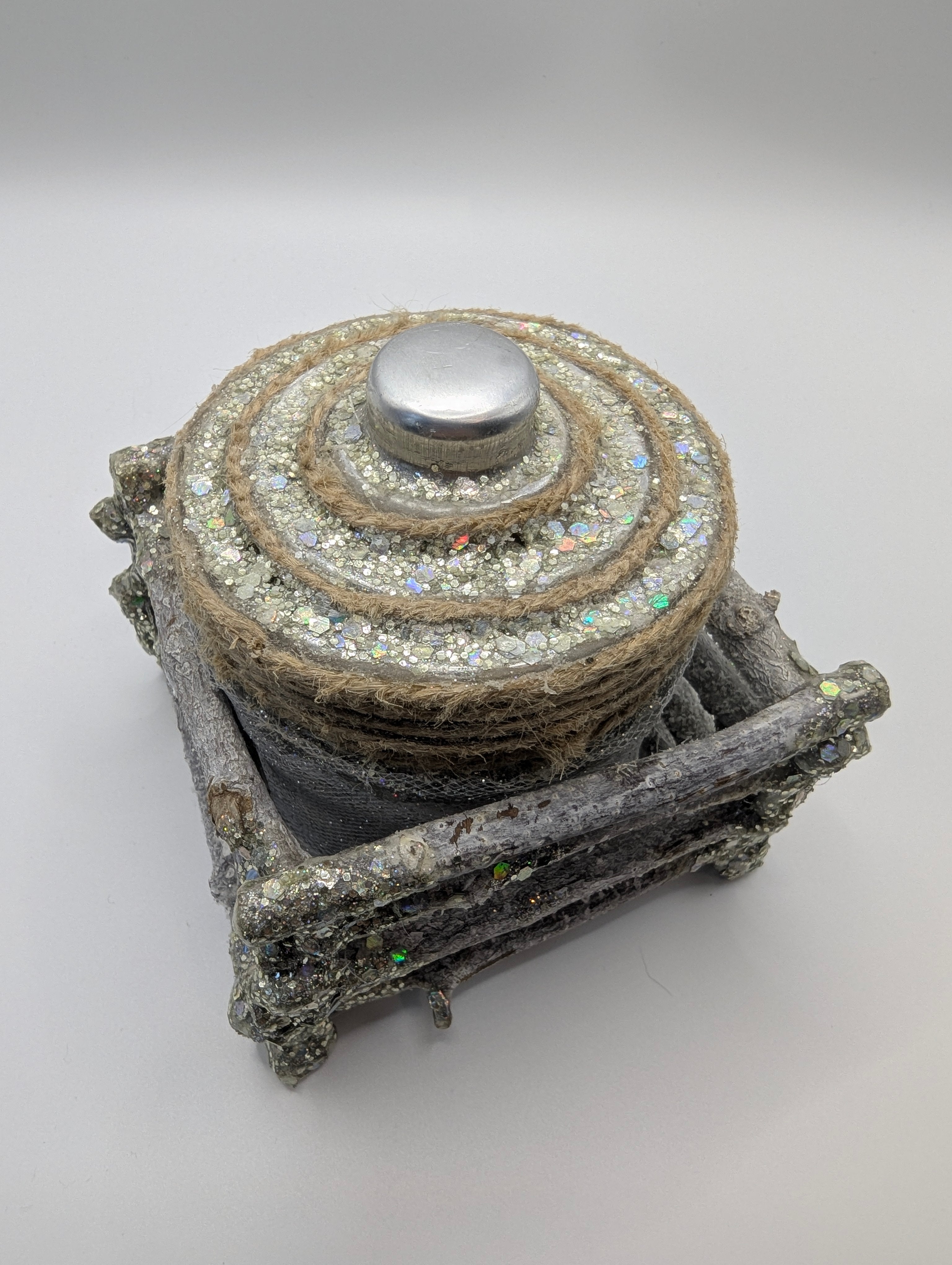 Silver and white lighted jar
