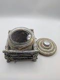 Silver and white lighted jar