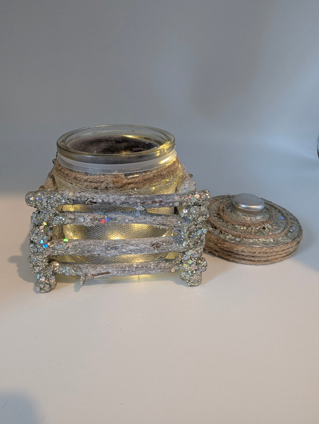 Silver and white lighted jar
