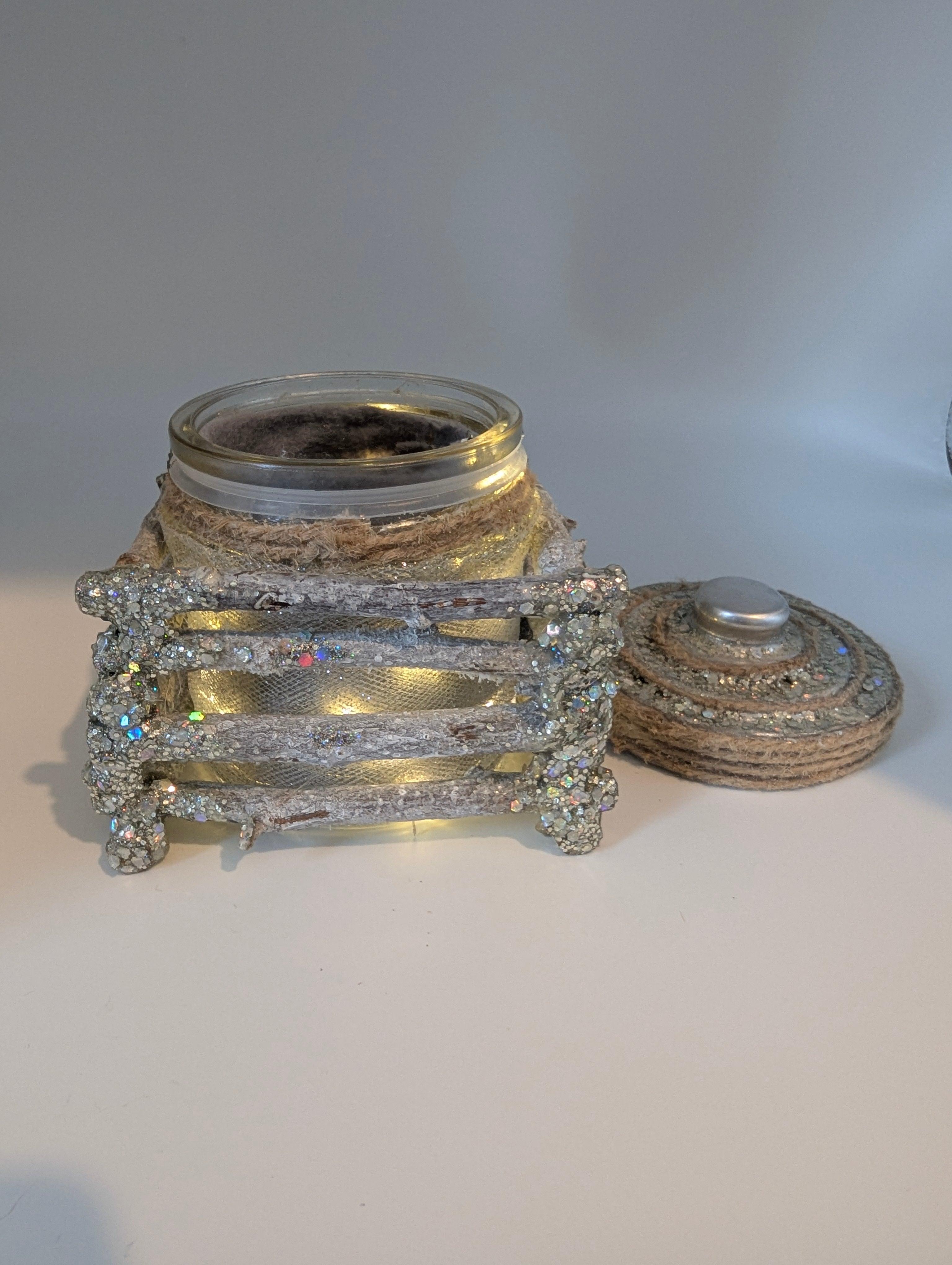 Silver and white lighted jar