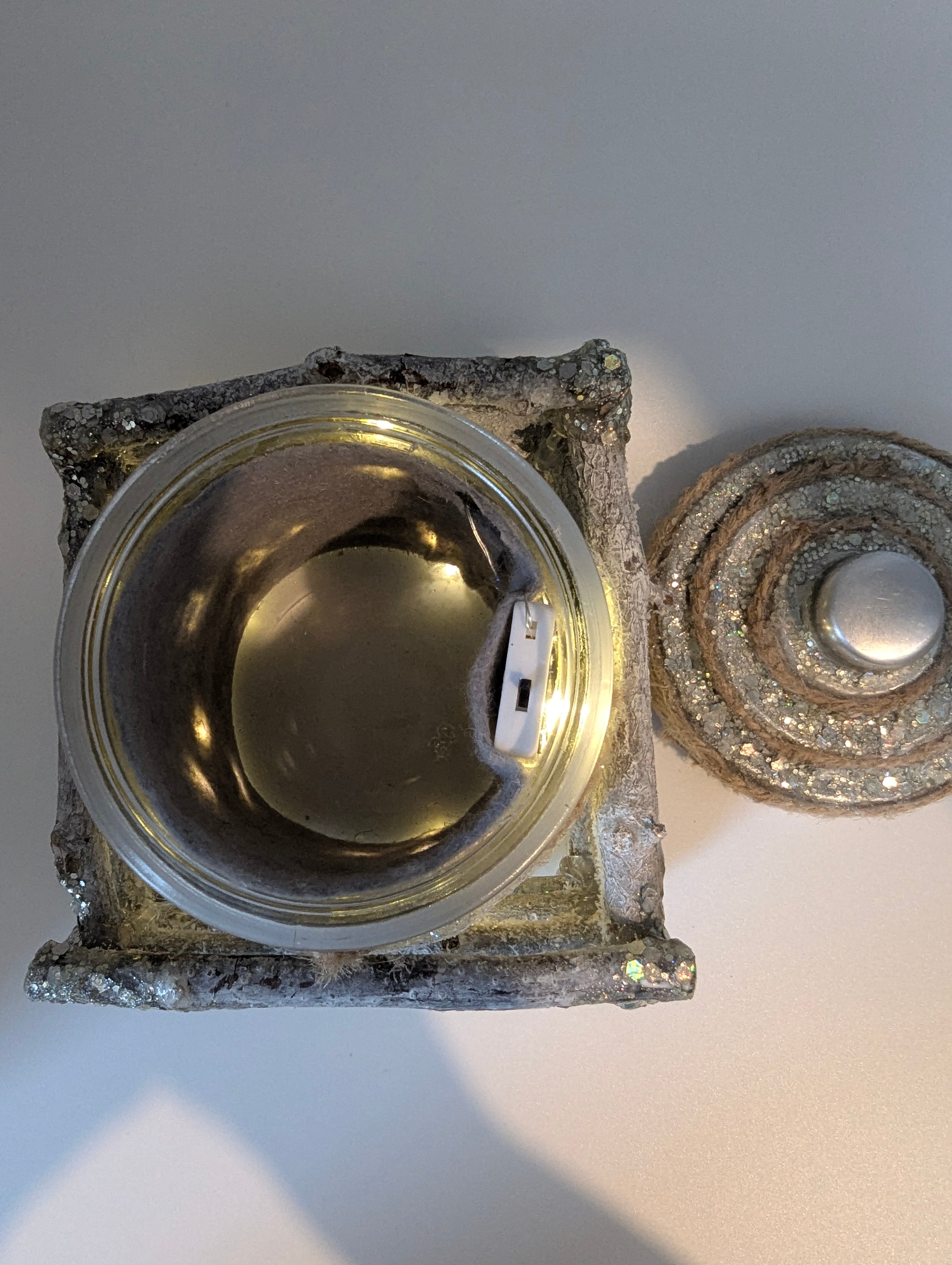 Silver and white lighted jar